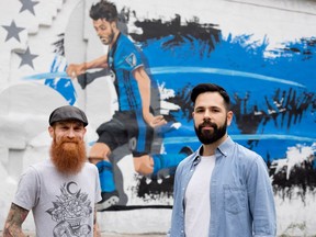 Marco Paradiso, right, drew a mural for the Montreal Impact, Shawn Davis painted Bleu-blanc-noir on a St-Laurent Blvd. wall in Montreal on Thursday May 25, 2017.