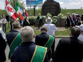 Montrealers take part in the annual Walk to the Stone honouring the 6,000 Irish buried at the Black Rock in Montreal on Sunday, May 28, 2017.