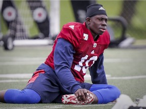 Montreal Alouettes safety Chris Ackie stretches during training camp at Bishop's University in Lennoxville, southeast of Montreal Monday May 29, 2017.