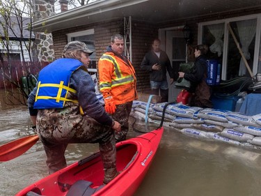 The flooding continues on Île Mercier, off Île Bizard on Friday, May 5, 2017. With more rain expected, more sand bags will be needed. (Dave Sidaway / MONTREAL GAZETTE)