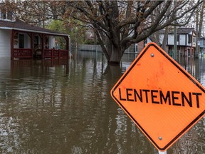Flooding on des Maçons Street in Pierrefonds on Monday.