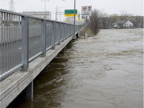 Water flows under the Galipeault Bridge in Ile-Perrot which was closed to traffic on Monday, May 8, 2017.