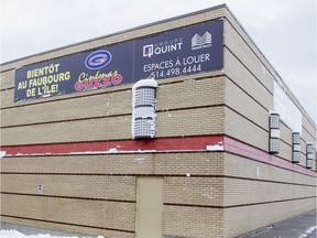 A banner announcing plans for a new Guzzo theatre hangs at a Pincourt mall last November.