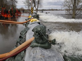 The army at the 1.2 km dike along Lalande Blvd. in Pierrefonds, on May 10, 2017. High capacity pumps are pumping the water from the sewer system to the river.