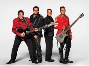 “We’ve been doing this for so long that we find ourselves performing as if Michael was right there next to us onstage,” says Jermaine Jackson, right, seen with  his brothers Tito, left, Jackie and Marlon.