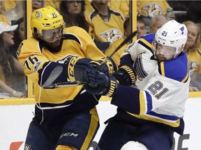 Nashville Predators defenseman P.K. Subban, left, and St. Louis Blues' Patrik Berglund battle for the puck during the first period in Game 4 of a second-round NHL hockey playoff series Tuesday, May 2, 2017, in Nashville, Tenn.