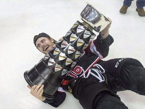 University of New Brunswick Varsity Reds Philippe Maillet falls with the University Cup after defeating the St. Francis Xavier X-Men 3-1 to win the Canadian Interuniversity Sports hockey championship in Halifax on March 20, 2016. Hockey players Sarah Bujold of St. Francis Xavier University and Maillet of the University of New Brunswick are among the finalists for the 25th annual BLG Awards.