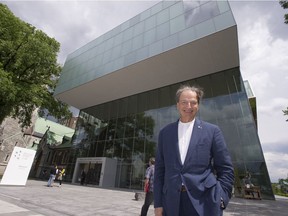 Businessman and philanthropist Pierre Lassonde poses in front of the Musée national des beaux-arts du Québec pavilion that bears his name in June 2016.