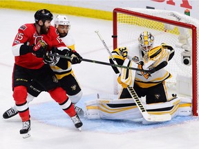 Pittsburgh Penguins goalie Matt Murray makes a save as Ottawa Senators centre Zack Smith and Penguins defenceman Trevor Daley battle in front during the third period of Game 6 of the Eastern Conference final in Ottawa on Tuesday, May 23, 2017.