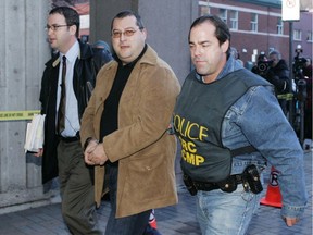 Police bring Francesco Del Balso, to RCMP headquarters during an early morning round up of more than 90 people Nov. 22, 2006, in Montreal.