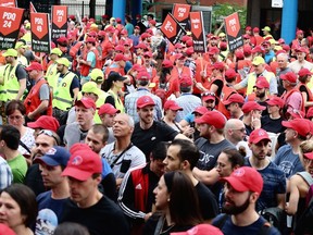 Members of Montreal police brotherhood gather outside their union office at the start of a protest on the day of Montreal's 375th birthday in Montreal, Wednesday, May 17, 2017.