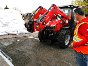 Rosen Christov directing sandbag operations at Pierrefonds Public Works during flooding across Quebec May 8, 2017.