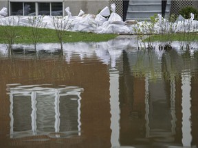 Sandbags protect the basement of a house surrounded by floodwaters in Vaudreuil-Dorion west of Montreal, Tuesday, May 9, 2017, following flooding in the region.