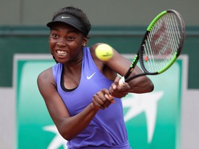 Montreal's Françoise Abanda returns the ball to France's Tessah Andrianjafitrimo during their first-round match at the Roland Garros on May 29, 2017 in Paris.