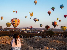 Photo of the day: A girl enjoys the hot-air balloons festival in Cajititlan, Jalisco state, Mexico, May 7, 2017.