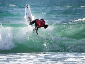 Photo of the day: France's Joan Duru competes in the heats 42 - Round 1 on May 23, 2017, in Biarritz, southwestern France, during the 2017 ISA World Surfing Games.