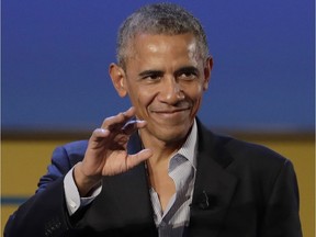 Former U.S. president Barack Obama salutes after giving a speech at the Global Food Innovation" summit in Milan, Italy, on Tuesday, May 9, 2017.