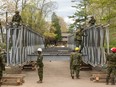 Members of the Canadian Forces install a temporary bridge to Île Verte in Laval on Saturday, May 13, 2017.