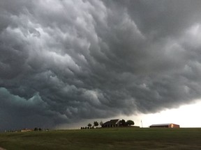 Storm clouds appear over a home near Meers, Okla., Tuesday, April 26, 2016. Strong thunderstorms capable of dropping grapefruit-sized hail and producing a few intense tornadoes popped up across the central U.S. on Tuesday after forecasters warned that millions of people faced a significant danger. (Robert MacDonald via AP) MANDATORY CREDIT ORG XMIT: NY113

MANDATORY CREDIT
AP