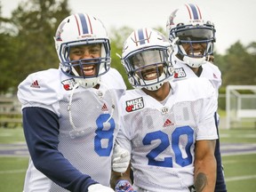 Alouettes' Nik Lewis, from left, Tyrell Sutton and B.J. Cunningham during a light moment at training camp at Bishop's University.