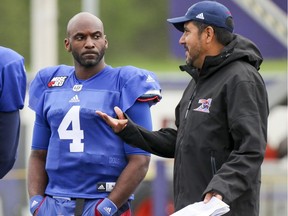Quarteback Darian Durant and quarterbacks coach Anthony Calvillo talk during training camp at Bishop's University. The team has put a lot of faith in the veteran Durant to help turn things around in Montreal.