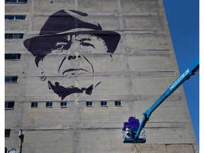 Kevin Ledo works on his massive Leonard Cohen mural as part of the Mural Fest in Montreal on Wednesday June 14, 2017. (Allen McInnis / MONTREAL GAZETTE)