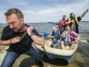 Derek Seguin pulls fellow comedians Heidi Foss, Abdul Butt, back left, K. Trevor Wilson, back right, and Mike Paterson from the water at Foss' home in Vaudreuil-Dorion on Thursday. They are part of the crew putting on the fundraiser Overflowing with Laughter.