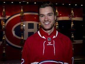 Newly acquired Montreal Canadiens forward Jonathan Drouin smiles outside the team's dressing room at the Bell Centre in Montreal, June 15, 2017.