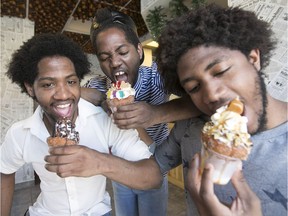 The three Deslouches brothers at Le P'tit Creux du Plateau, where the claim to fame is a churros cone – served in a cup for easier eating.  From left: Brother Marc shows off the Papimarco; Antoine, the Papitonio; and Christ bites into the Papichristo.