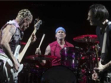 Red Hot Chili Peppers' Flea, left, Chad Smith, centre, and Josh Klinghoffer at the Bell Centre in Montreal on Tuesday June 20, 2017.