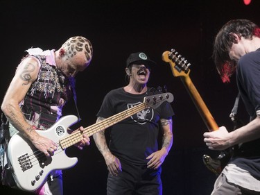 Red Hot Chili Peppers' Flea, left, Anthony Kiedis, centre, and Josh Klinghoffer at the Bell Centre in Montreal on Tuesday June 20, 2017.