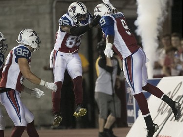 Montreal Alouettes' Ernest Jackson (9) celebrates touchdown with teammates B.J. Cunningham (85) and Alex Pierzchalski (82) during third quarter action in Montreal on Thursday June 22, 2017.