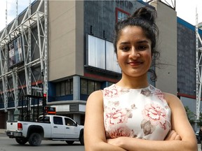 Safia Ahmad poses in front of the Cinéplex Forum, which was known as the AMC Theatre when she got her first job there as "a hormonal and insecure teenager."