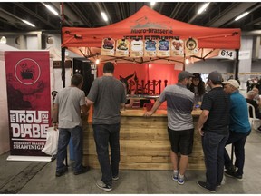 People gather around the kiosk of Le Trou du Diable microbrewery at the Mondial de la biere 2017 in Montreal on Friday June 16, 2017. (Pierre Obendrauf / MONTREAL GAZETTE) ORG XMIT: 58837 - 1000
Pierre Obendrauf, Montreal Gazette