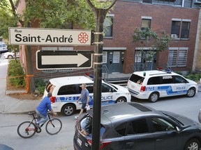 Police have taped off the scene of Tuesday evening's shooting in an apartment at the corner of Robillard Ave. and St-André St.