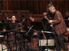 American guitarist Bill Frisell performs with drummer Joey Baron and the BBC Symphony Orchestra in a scene from Emma Franz’s documentary Bill Frisell, A Portrait.