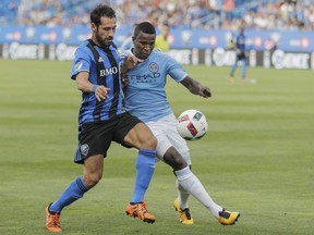 Montreal Impact forward Matteo Mancosu, left, battles for the ball against New York City FC defender Jefferson Mena, right, during the second half of their MLS soccer match at Saputo Stadium in Montreal on Sunday, July 17, 2016.