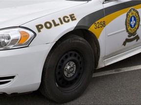 A Surete du Quebec police car is parked in front of a warehouse as police check on maple syrup containers during a police search in St-Nicolas, a suburb of Levis, Que., Friday, October 12, 2012. THE CANADIAN PRESS/Jacques Boissinot

STK, Stock, Generic, Sûreté du Québec, SQ
Jacques Boissinot,