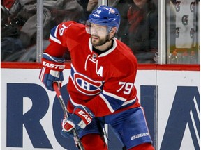 Montreal Canadiens' Andrei Markov looks to pass the puck during second period of National Hockey League game against the Florida Panthers in Montreal Tuesday April 5, 2016.