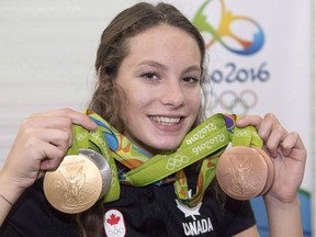 Penny Oleksiak of Toronto shows off the four medals -- a gold, silver and two bronze -- she won at the 2016 Summer Olympics during a news conference on Aug. 14, 2016 in Rio de Janeiro, Brazil. Oleksiak was the winner of the Lou Marsh Trophy as Canada's athlete of the year.