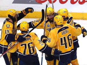 Filip Forsberg (#9) of the Nashville Predators celebrates with his teammates after scoring an open-net goal against the Pittsburgh Penguins during the third period in Game Four of the 2017 NHL Stanley Cup Final at the Bridgestone Arena on June 5, 2017 in Nashville, Tennessee.