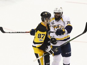 P.K. Subban of the Nashville Predators pushes Sidney Crosby of the Pittsburgh Penguins with his stick during the second period in Game Two of the 2017 NHL Stanley Cup Final at PPG Paints Arena on May 31, 2017, in Pittsburgh.