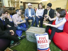 Deborah Hayek, far right, the head of research and development, holds a meeting with her team at the Desjardins Lab: from left, Samuel Whaite, Cyril Cosenza, Ilias Benjelloun, Catherine Barette and Mansib Rahman.