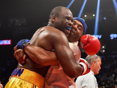 Adonis Stevenson (left) reacts with trainer SugarHill Steward (right) for his victory against Andrzej Fonfara in the second round during the WBC light heavyweight world championship match at the Bell Centre on June 3, 2017 in Montreal, Quebec, Canada.  Adonis Stevenson defeated Andrzej Fonfara in the second round by way of technical knockout.