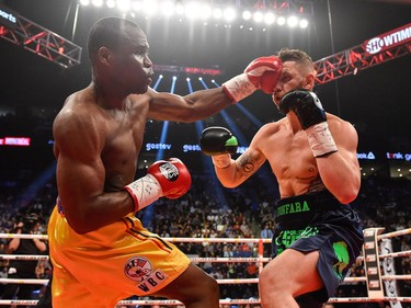 Adonis Stevenson (left) lands a punch against Andrzej Fonfara during the WBC light heavyweight world championship match at the Bell Centre on June 3, 2017 in Montreal, Quebec, Canada.  Adonis Stevenson defeated Andrzej Fonfara in the second round by way of technical knockout.