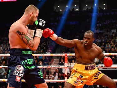 Andrzej Fonfara (left) sidesteps a punch against Adonis Stevenson during the WBC light heavyweight world championship match at the Bell Centre on June 3, 2017 in Montreal, Quebec, Canada.  Adonis Stevenson defeated Andrzej Fonfara in the second round by way of technical knockout.