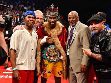 Adonis Stevenson poses for photos with his trainer SugarHill Steward (left) and Sam Watson (right) during the WBC light heavyweight world championship match  at the Bell Centre on June 3, 2017 in Montreal, Quebec, Canada.  Adonis Stevenson defeated Andrzej Fonfara in the second round by way of technical knockout.