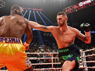 Andrzej Fonfara throws a right punch against Adonis Stevenson during the WBC light heavyweight world championship match at the Bell Centre on June 3, 2017 in Montreal, Quebec, Canada.  Adonis Stevenson defeated Andrzej Fonfara in the second round by way of technical knockout.