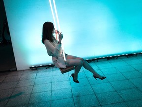 Photo of the day: A Chinese woman swings on a swing during a party in Beijing on June 9, 2017. / AFP PHOTO / FRED DUFOURFRED DUFOUR/AFP/Getty Images