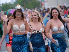 Revellers enjoy the festivities at the annual Mermaid Parade in Coney Island in New York on Saturday, June 17, 2017.